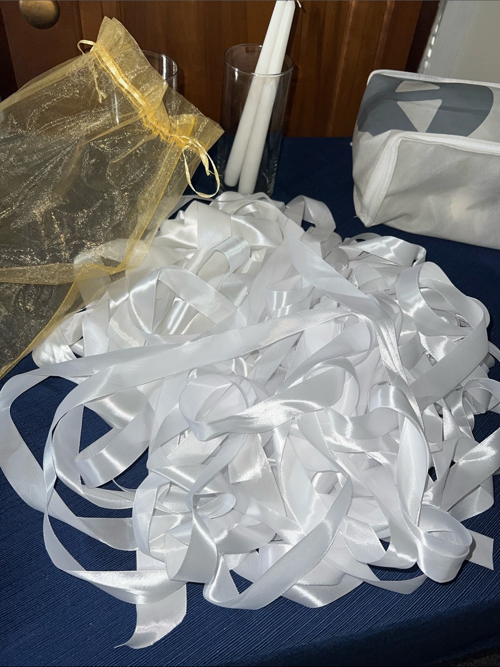 White satin ribbon pile wedding crafting